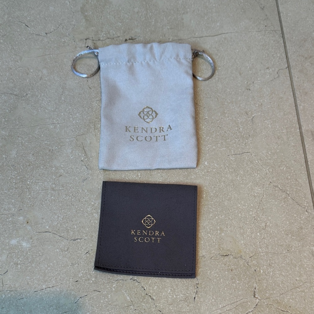 Kendra Scott Cream Pouch and Black Pouch